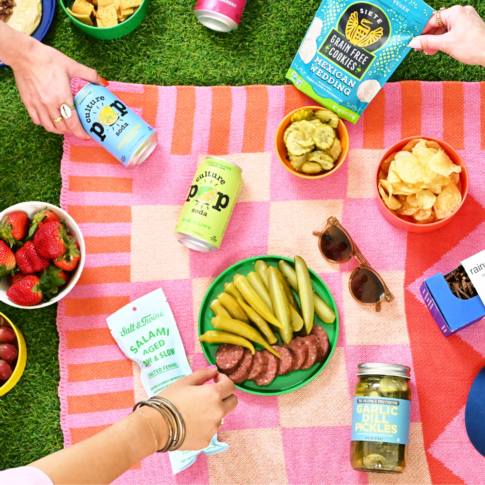 picnic provisions with pickles, salami, and culture pop