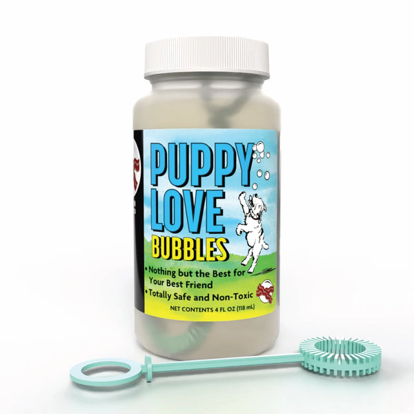 Bottle of 'Puppy Love Bubbles' with a bubble wand on a white background