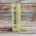 Tumbler resembling sweet cream butter sitting on a wooden background
