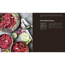 Recipe for pink pickled onions with ingredients and preparation text on a book page.