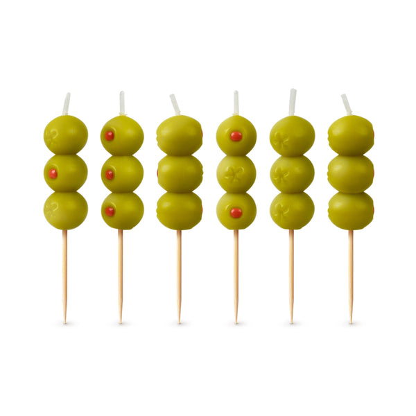 Candles that resemble martini olives on a toothpick