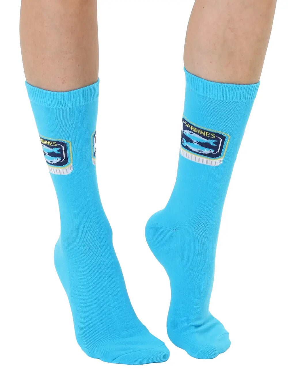Blue socks with a tinned fish design on a white background