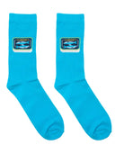 Pair of blue socks with a tinned fish design on a white background