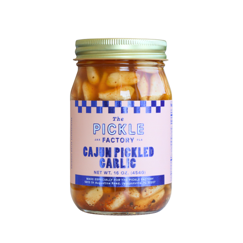 Jar of Cajun Pickled Garlic from The Pickle Factory on a white background