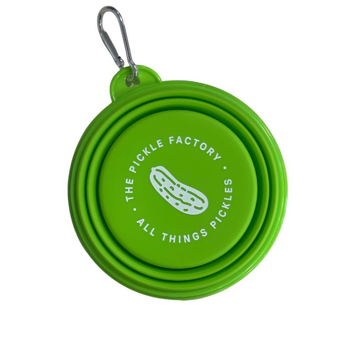 Green collapsible pet bowl with 'The Pickle Factory' logo on a white background