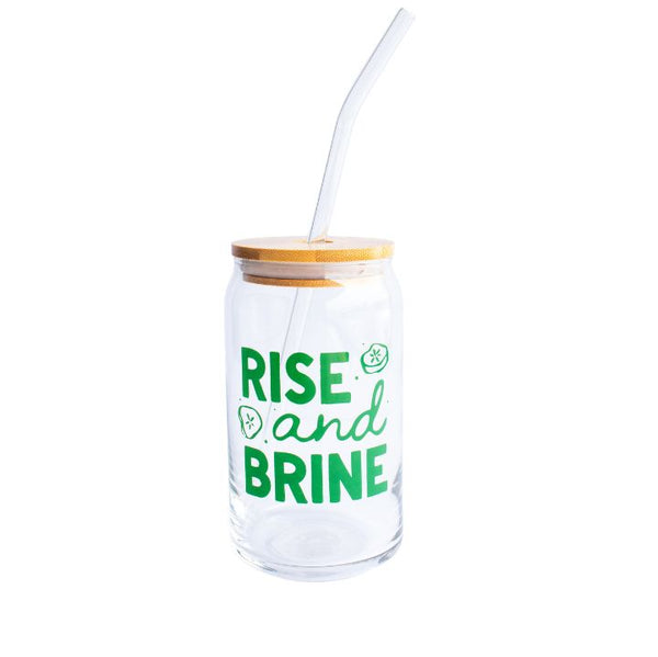 Clear glass can with 'Rise and Brine' text, bamboo lid, and straw on a white background