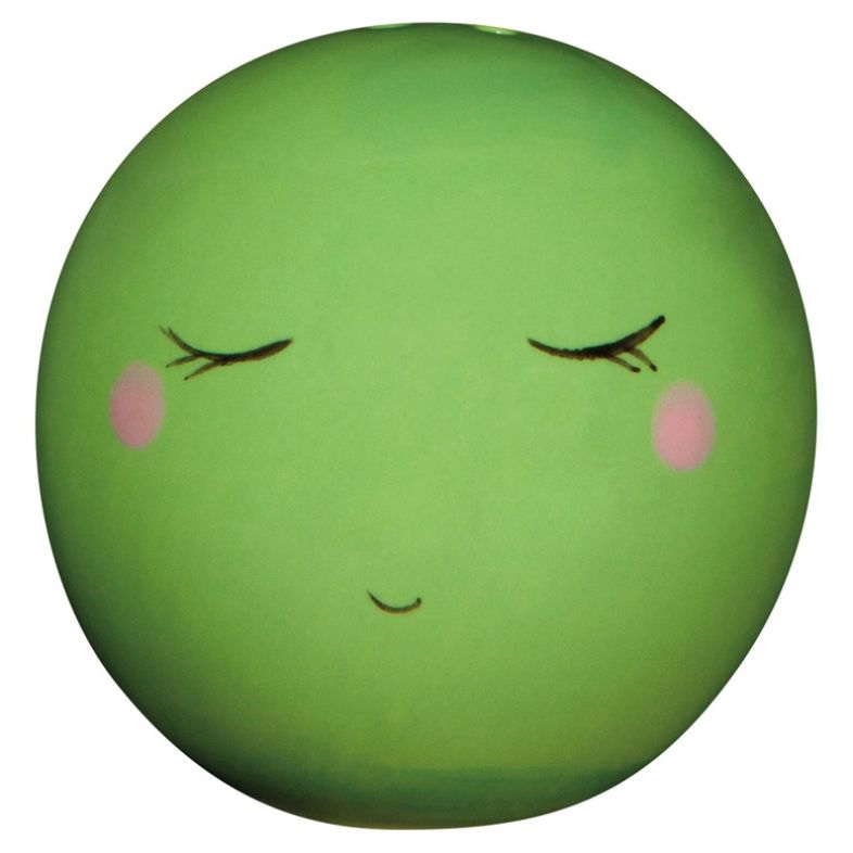 Green pea-shaped salt and pepper shaker with a face on a white background