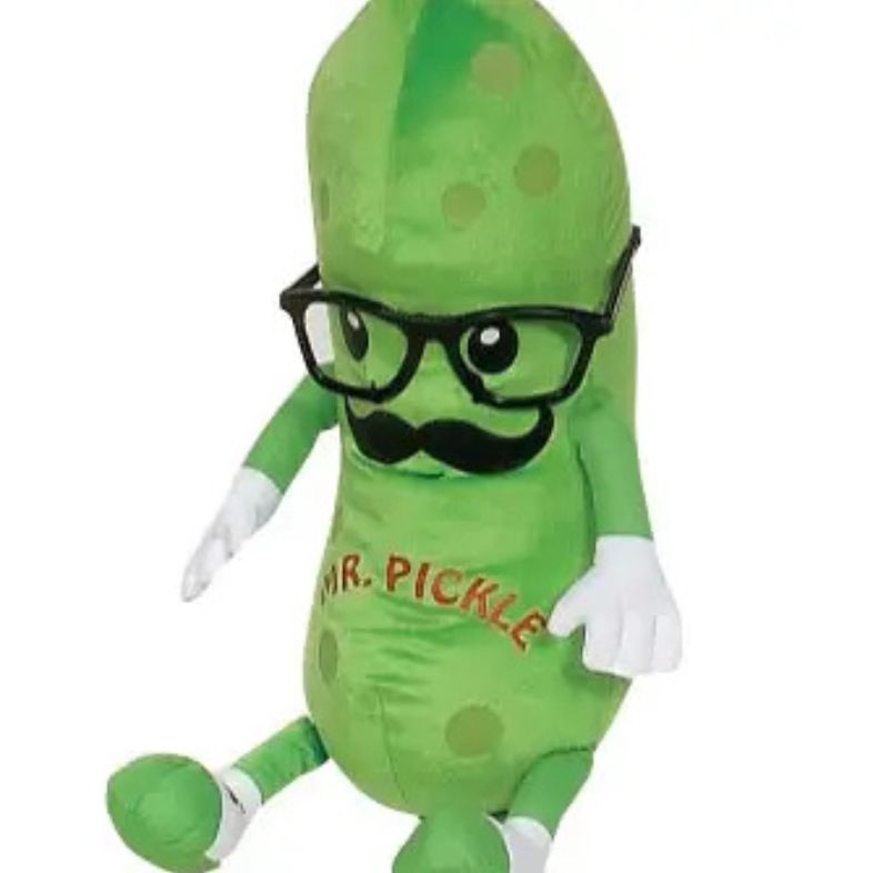 Green plush pickle toy with glasses and a mustache labeled 'Mr. Pickle' on a white background