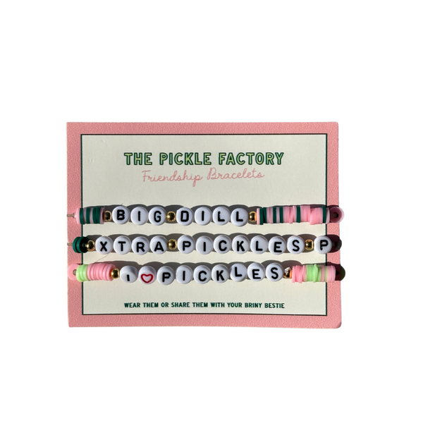 Set of friendship bracelets with text on a branded card, displayed against a white background.