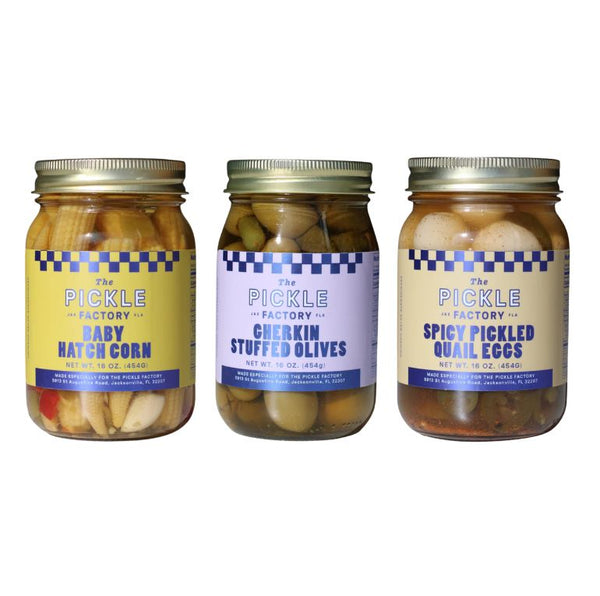 Three jars of pickles from The Pickle Factory on a white background