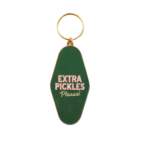 Green enamel hotel-style keychain that reads "Extra Pickles Please!" in pink lettering on a white background.